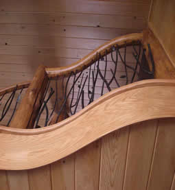 Custom Log Spiral Stairs and Metal Railing
